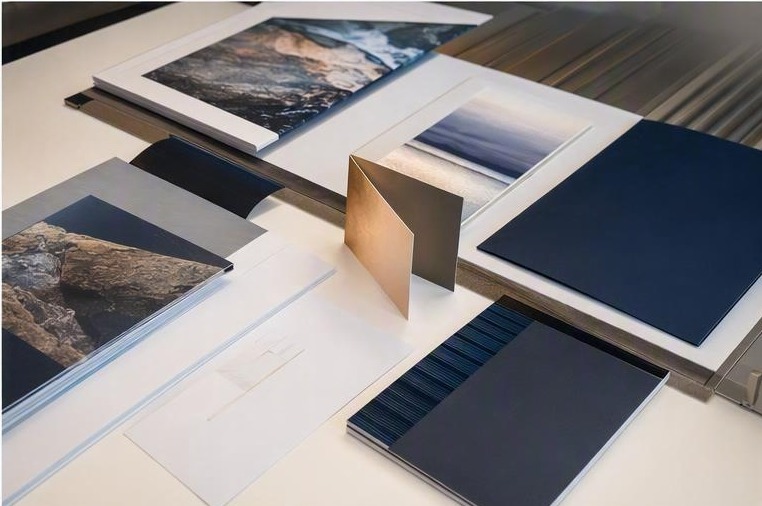 Premium commercial brochures, catalogues and stationery on a production table