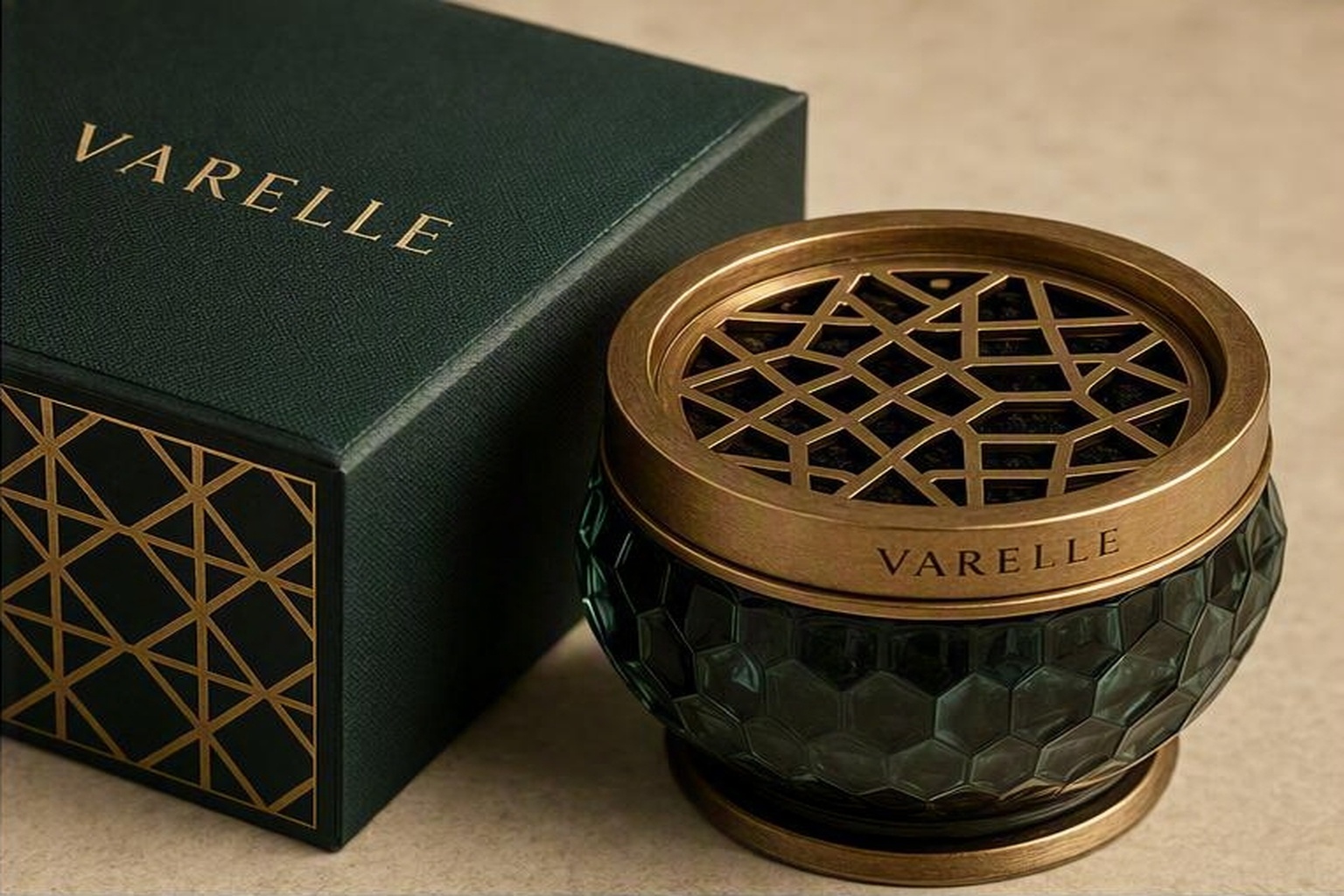 Luxury incense burner with brass geometric lattice lid paired with custom emerald rigid presentation box